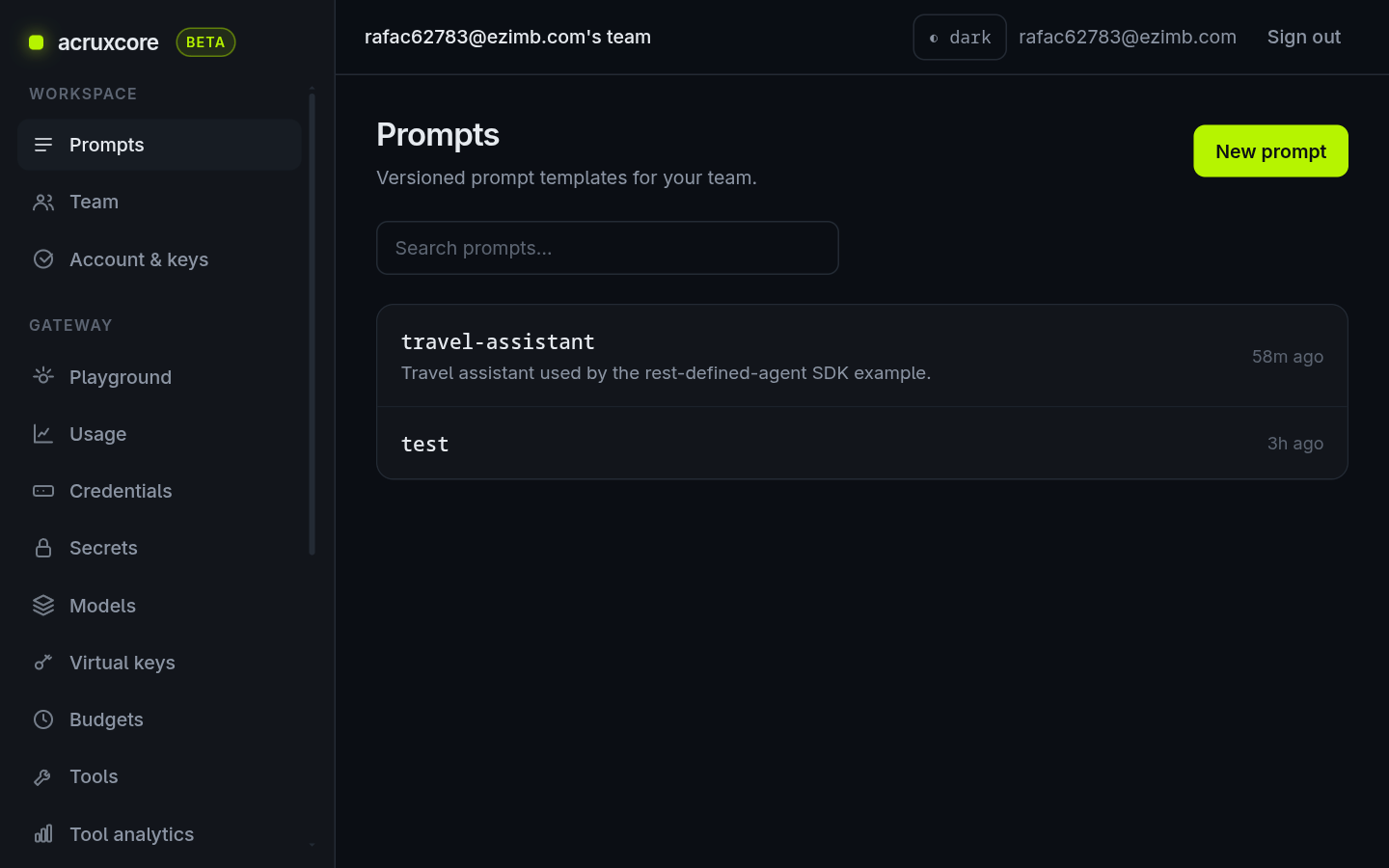 The Prompts list in the acruxcore dashboard, showing a travel-assistant entry with its description and a test prompt below it